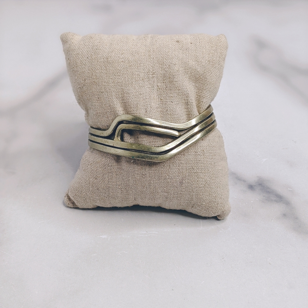 Silver colored wire work cuff bracelet